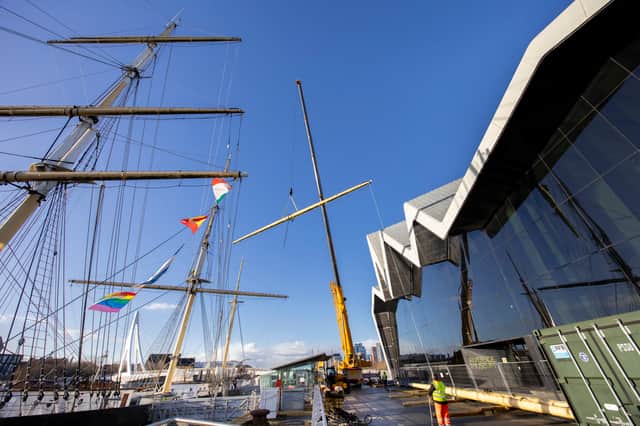Masts being removed by crane from the Tall Ship Glenlee beside the Riverside Museum in Glasgow this week