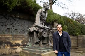 Creative Director Alan Lane next to ‘The Call’ statue in Edinburgh’s Princes Street Gardens 