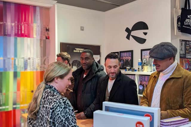 Long-time fans queued to meet the band and get their records signed