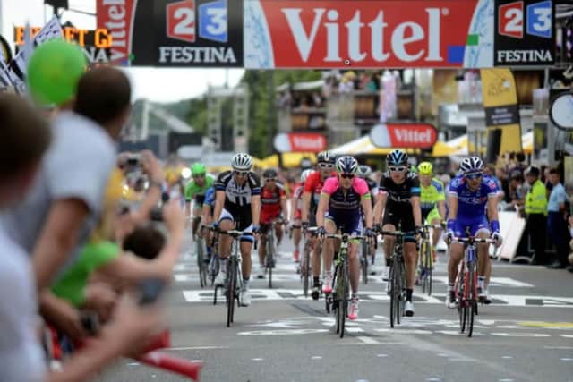Geraint Thomas crosses the finish line in Sheffield when the Tour de France came to the Steel City in 2014