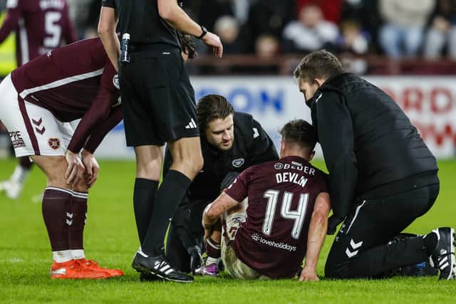 Cammy Devlin receives treatment during Hearts' 2-0 win over St Mirren.