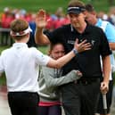 Stephen Gallacher is congratulated by his son Jack and daughter Ellie after winning the Omega Dubai Desert Classic for the second year running in 2014 