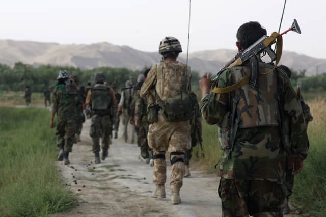 British and Afghan National Army soldiers pictured in Sangin Valley, Helmand Province, Afghanistan in 2007 (Picture: Marco Di Lauro)