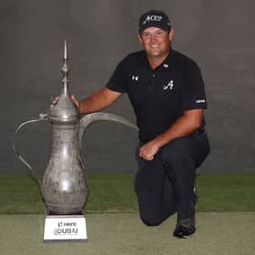 Patrick Reed poses with the iconic Dallah Trophy after winning the Hero Dubai Desert Classic at Emirates Golf Club