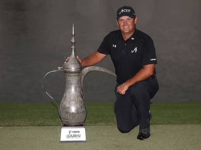 Patrick Reed poses with the iconic Dallah Trophy after winning the Hero Dubai Desert Classic at Emirates Golf Club