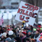 People protest outside the Minnesota State Capitol following the fatal shooting of Renee Good by a US Immigration and Customs Enforcement agent in Saint Paul, Minnesota (Picture: Charly Triballeau)