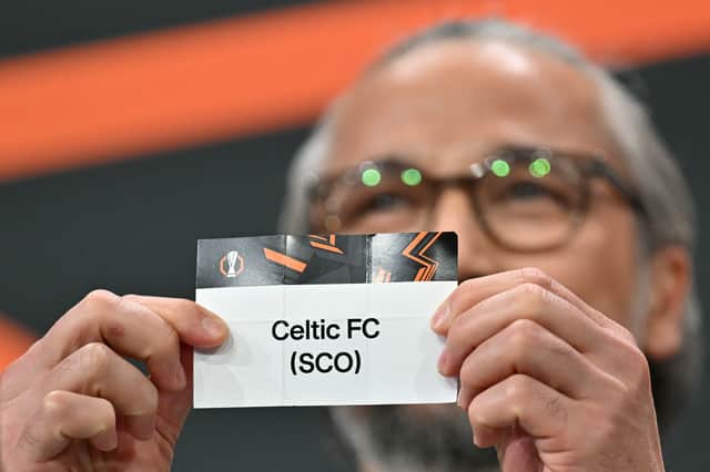Former Turkish player and UEFA Europa League ambassador Ilhan Mansiz holds up the slip of Celtic during the 2025-2026 UEFA Europa League knockout phase play-off draw at the House of European Football in Nyon on January 30, 2026. (Photo by Harold CUNNINGHAM / AFP via Getty Images)