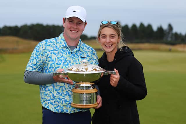 Bob MacIntyre shows off the Genesis Scottish Open trophy with his girlfriend Shannon Hartley at The Renaissance Club in 2014