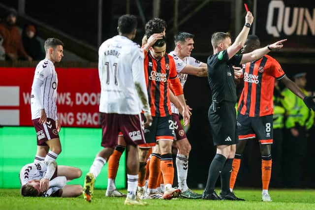 Pan Camara is sent off by referee Calum Scott in Hearts' win over Dundee United.