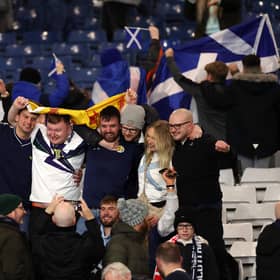 Scotland Fans celebrate after the team's victory during the FIFA World Cup 2026 qualifier match between Scotland and Denmark at Hampden Park on November 18, 2025.