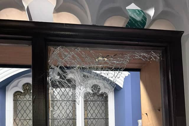 The criminal smashed through the windows and glass shelves