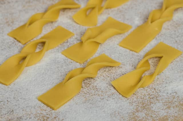 Here are homemade faworki, ready to be fried for Fat Thursday.