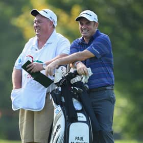 Paul McGinley and his caddie James ‘Edinburgh Jimmy’ Rae share a joke during the 2014 Italian Open Circolo Golf Torino 