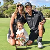 Anthony Kim celebrates winning the LIV Golf Adelaide tournament with his wife Emily and daughter Bella