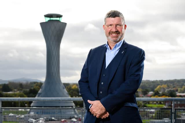 Edinburgh Airport chief executive Gordon Dewar with its air traffic control tower