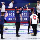 Grant Hardie, Hammy McMillan, Bruce Mouat and Bobby Lammie of Great Britain celebrate victory over Switzerland in the men's curling semi-final at the 2026 Winter Olympics. (Photo by Richard Heathcote/Getty Images)