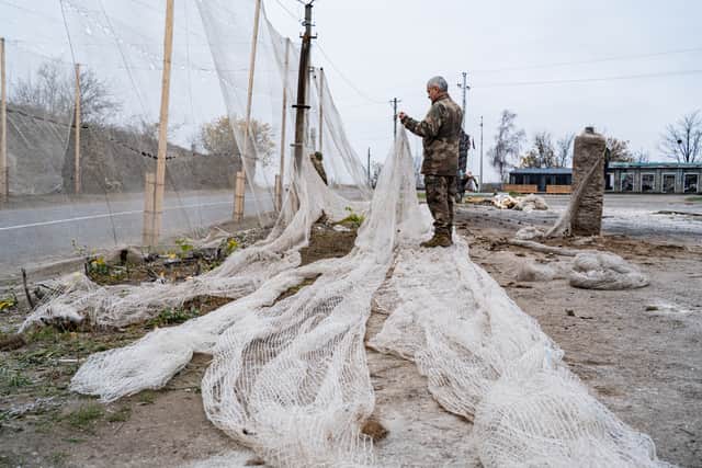 Ukrainian soldiers covering the roads with fishing nets as a protection from drones attacs in the region of Sumy in the east of Ukraine in November 2025. PIC: Getty/Hans Lucas.