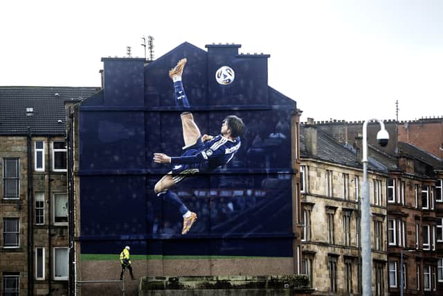 A mural of Scott McTominay's iconic overhead kick, which helped send Scotland to World Cup, has appeared near Hampden Park. The artwork, which is being painted in partnership with Adidas and the SFA, has appeared on the side of a building on Somerville Drive, not far from where the unforgettable moment took place.
