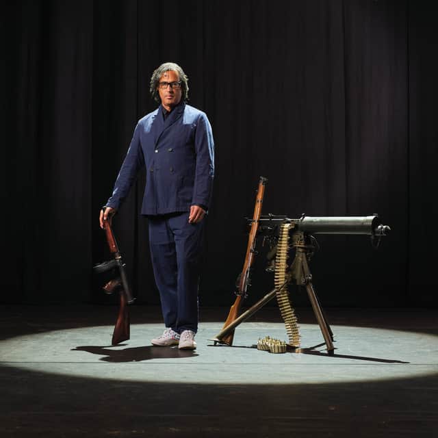David Olusoga with some of the weapons that feature in his live UK show A Gun Through Time.