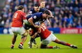 Scotland's Marshall Sykes (centre) is tackled by Tonga's Lotu Inisi (left) and Sam Moli (right) during the Quilter Nations Series match at Scottish Gas Murrayfield, Edinburgh on Sunday, November 23, 2025. 