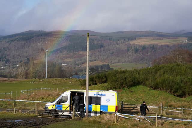 Police at the scene in the Pitilie area on the outskirts of Aberfeldy, where Mr Low 's body was found. Picture: PA