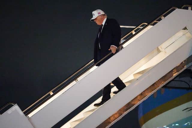 President Donald Trump arrives on Air Force One at Palm Beach International Airport in West Palm Beach, Florida.