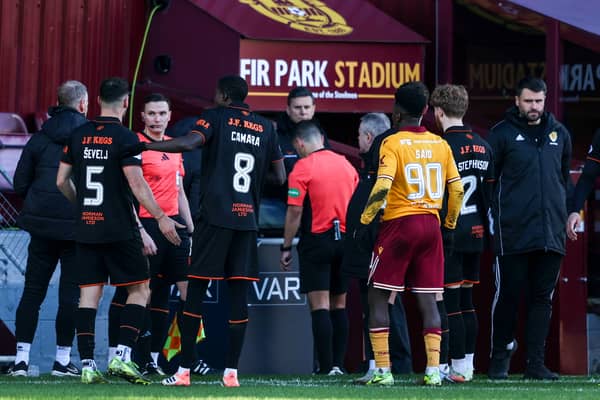 Referee Nick Walsh checks with VAR before awarding a penalty to Motherwell in their 2-0 win over Dundee United at Fir Park. (Photo by Craig Foy / SNS Group)