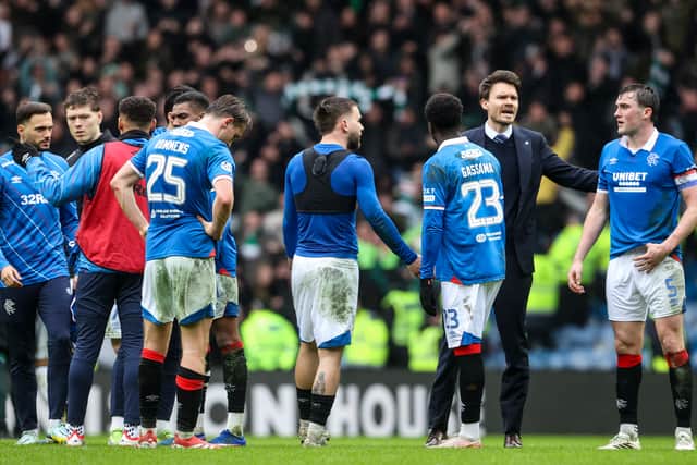 Rangers players show their disappointment after being pegged by in the final minutes against Celtic.