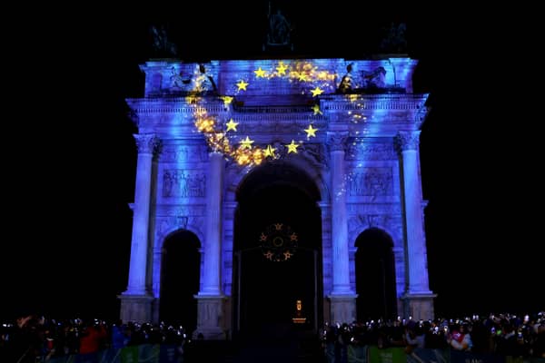 The European Union flag is projected onto the Arco della Pace during the opening ceremony of the 2026 Winter Olympics in Milan (Picture: Jamie Squire)