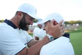 Jon Rahm and Rory McIlroy pictured celebrating Europe’s win in last year’s Ryder Cup in New York 