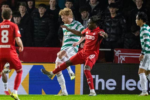 Celtic's Liam Scales fouls Aberdeen's Toyosi Olusanya inside the box conceding a penalty during the Premiership match at Pittodrie on Wednesday. (Photo by Paul Devlin / SNS Group)