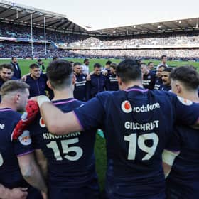 Scotland's Sione Tuipulotu speaks to his team after the Six Nations win over France.