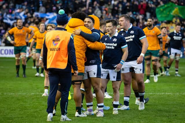 Scotland's Sione Tuipulotu (R) and Australia's Isaac Kailea after the match at Murrayfield in 2024.