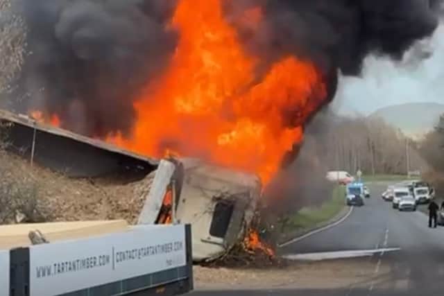 The A1 is closed at Haddington after a two-vehicle crash which saw a lorry burst into flames.
