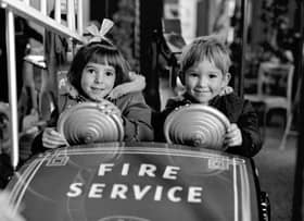 Children enjoy the funfair roundabout inside Goldbergs department store, Edinburgh, in November 1968