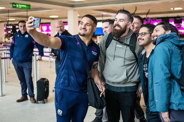 Scotland captain Sione Tuipulotu with supporters at Edinburgh airport ahead of the squad's departure for Dublin for their final Six Nations fixture, against Ireland.