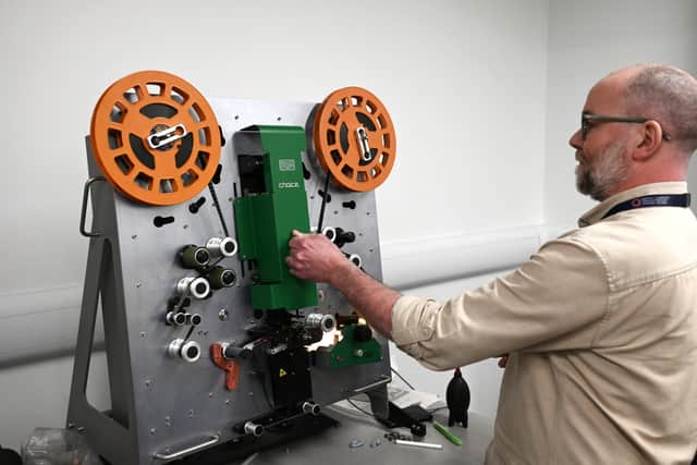 Senior preservation technician Stuart Wilson uses the archive's film scanner. Pic: John Devlin