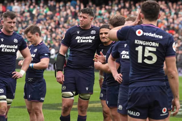 Scotland's Grant Gilchrist (centre) and captain Sione Tuipulotu console each other after the defeat by Ireland in the Guinness Six Nations match at the Aviva Stadium in Dublin.