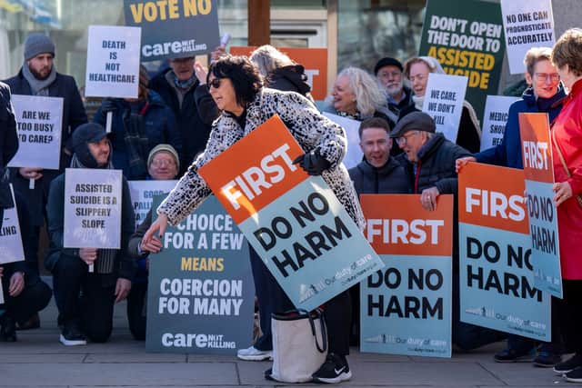 Protesters outside the Scottish Parliament ahead of the assisted dying vote