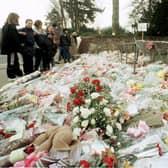 The flowers massed at the gates of Dunblane Primary School following the shooting of teacher Gwen Mayor and sixteen young children in 1996