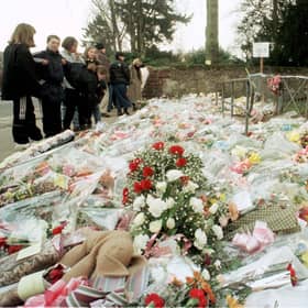 The flowers massed at the gates of Dunblane Primary School following the shooting of teacher Gwen Mayor and sixteen young children in 1996