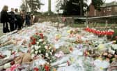 The flowers massed at the gates of Dunblane Primary School following the shooting of teacher Gwen Mayor and sixteen young children in 1996