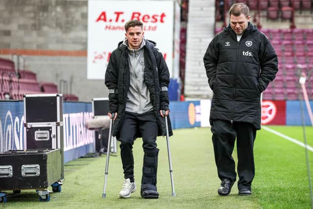 Hearts' Cammy Devlin was left in a protective boot and on crutches after picking up an ankle injury against St Mirren in January. (Photo by Ross Parker / SNS Group)