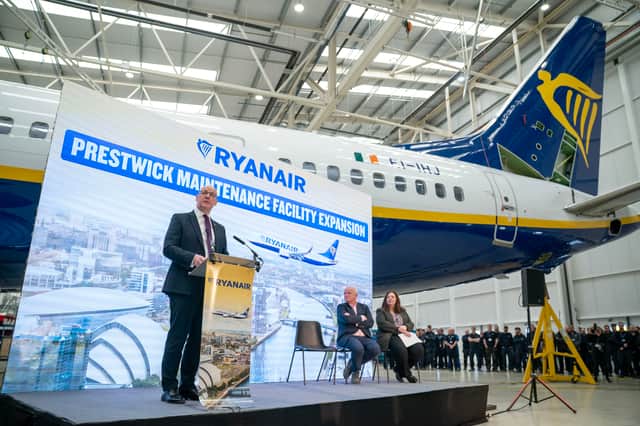 First Minster John Swinney welcoming Ryanair's announcement at its Prestwick aircraft maintenance base on Friday, with the airline's chief executive Eddie Wilson and Scotland Office minister Kirsty McNeill