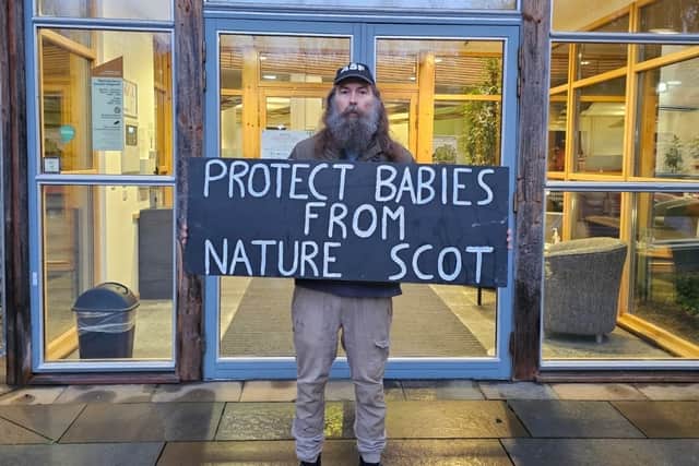 Jamie Moyes protesting outside NatureScot building