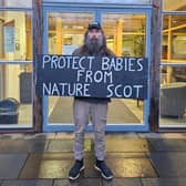 Activist protesting outside NatureScot building 