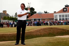 Phil Mickelson shows off the Claret Jug after winning the most recent staging of The Open at Muirfield in 2013
