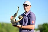 Matt Fitzpatrick  poses with the trophy after winning the Valspar Championship at Copperhead Course at Innisbrook Resort and Golf Club in  Florida 