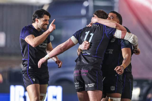 Adam Hastings, left, celebrates with Glasgow Warriors team-mates after a try in the win over Leinster.