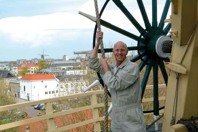 Matthieu the miller, demonstrates the workings of a windmill in Schiedam.